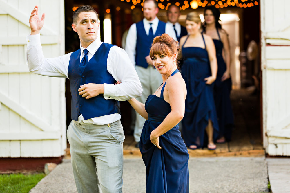 bozeman-montana-wedding-roys-barn-bridesmaid-groomsmen-strike-pose.jpg