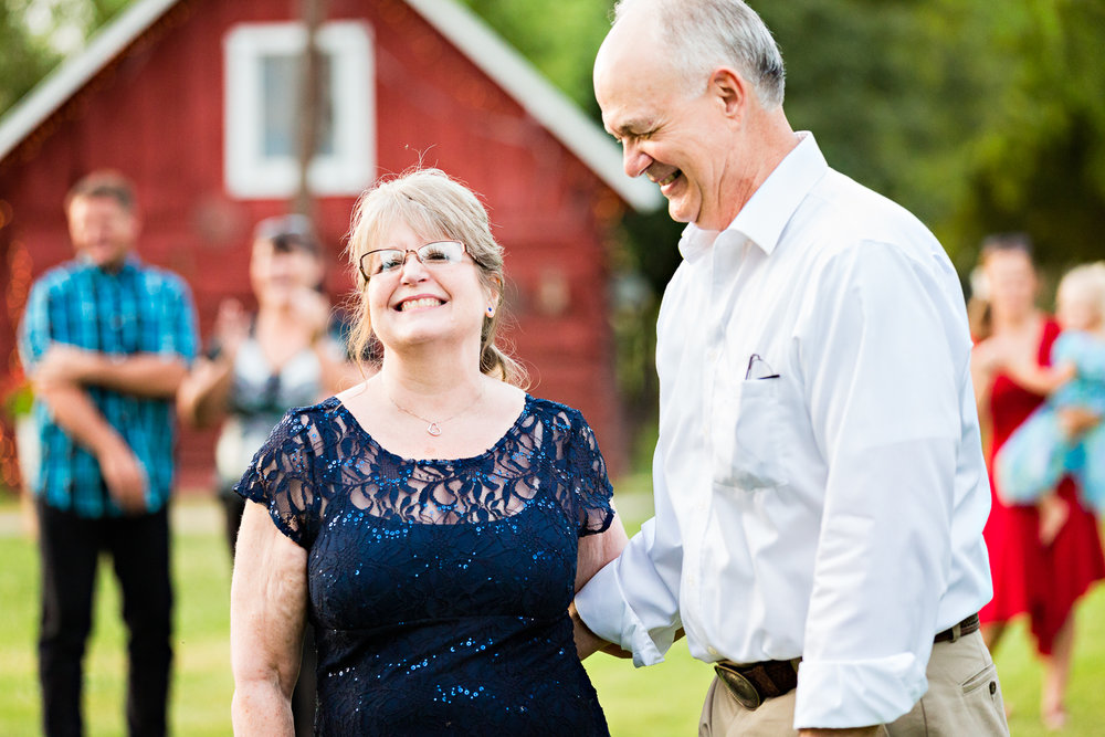 bozeman-montana-wedding-roys-barn-brides-parents-laughing.jpg