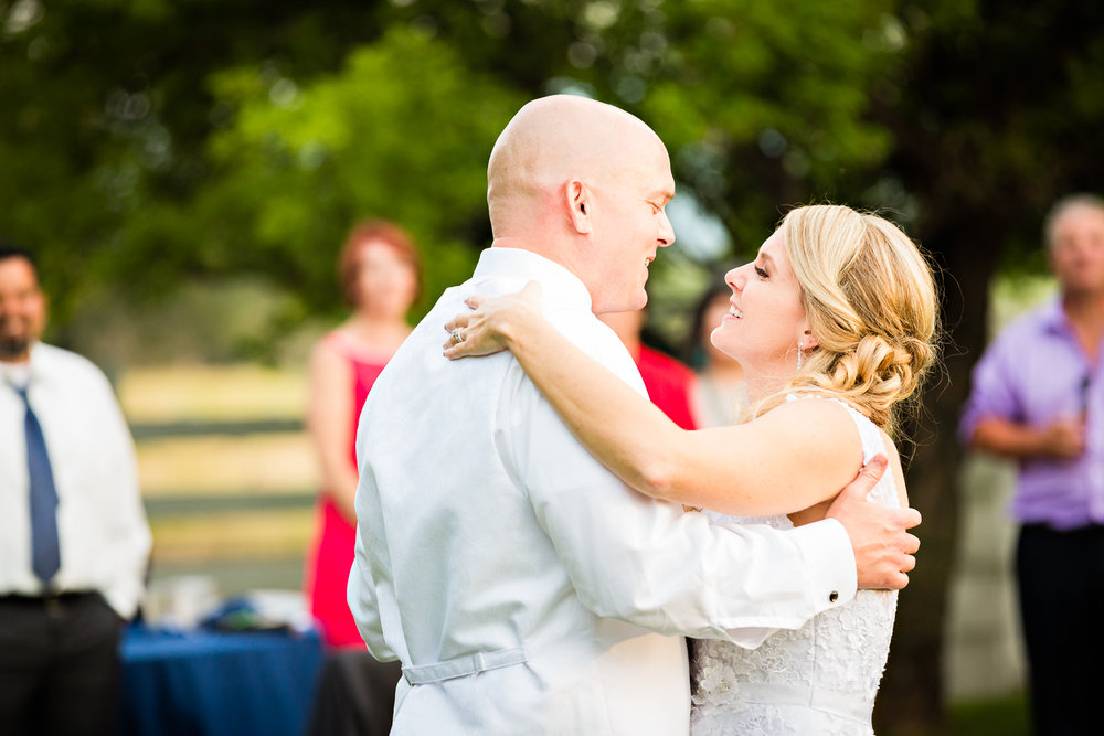 bozeman-montana-wedding-roys-barn-bride-groom-smile-during-first-dance.jpg