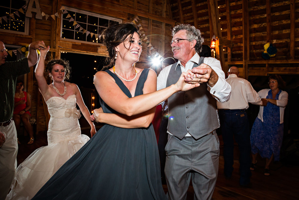 bozeman-wedding-big-yellow-barn-reception-candid-father-daughter-dancing.jpg