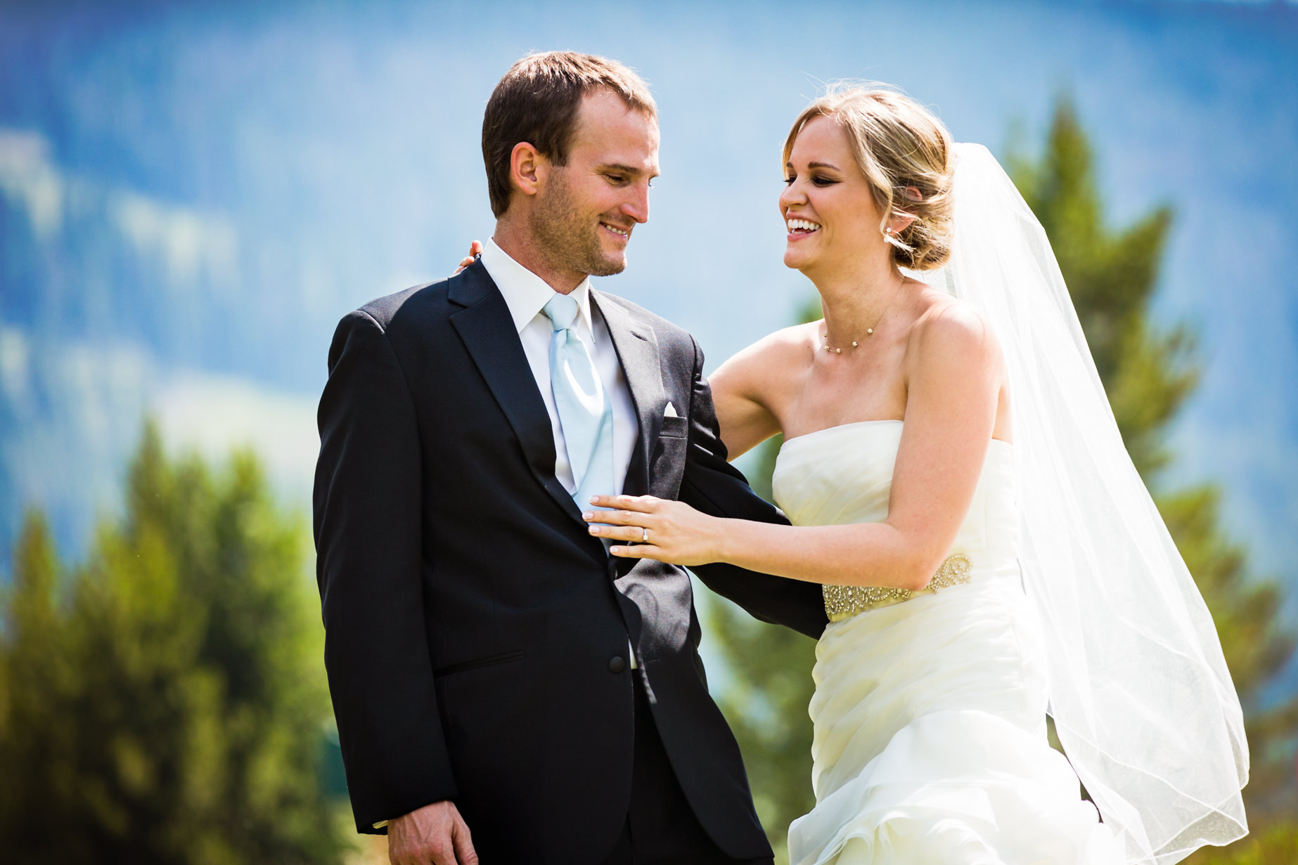 big-sky-resort-wedding-bride-hugs-groom.jpg