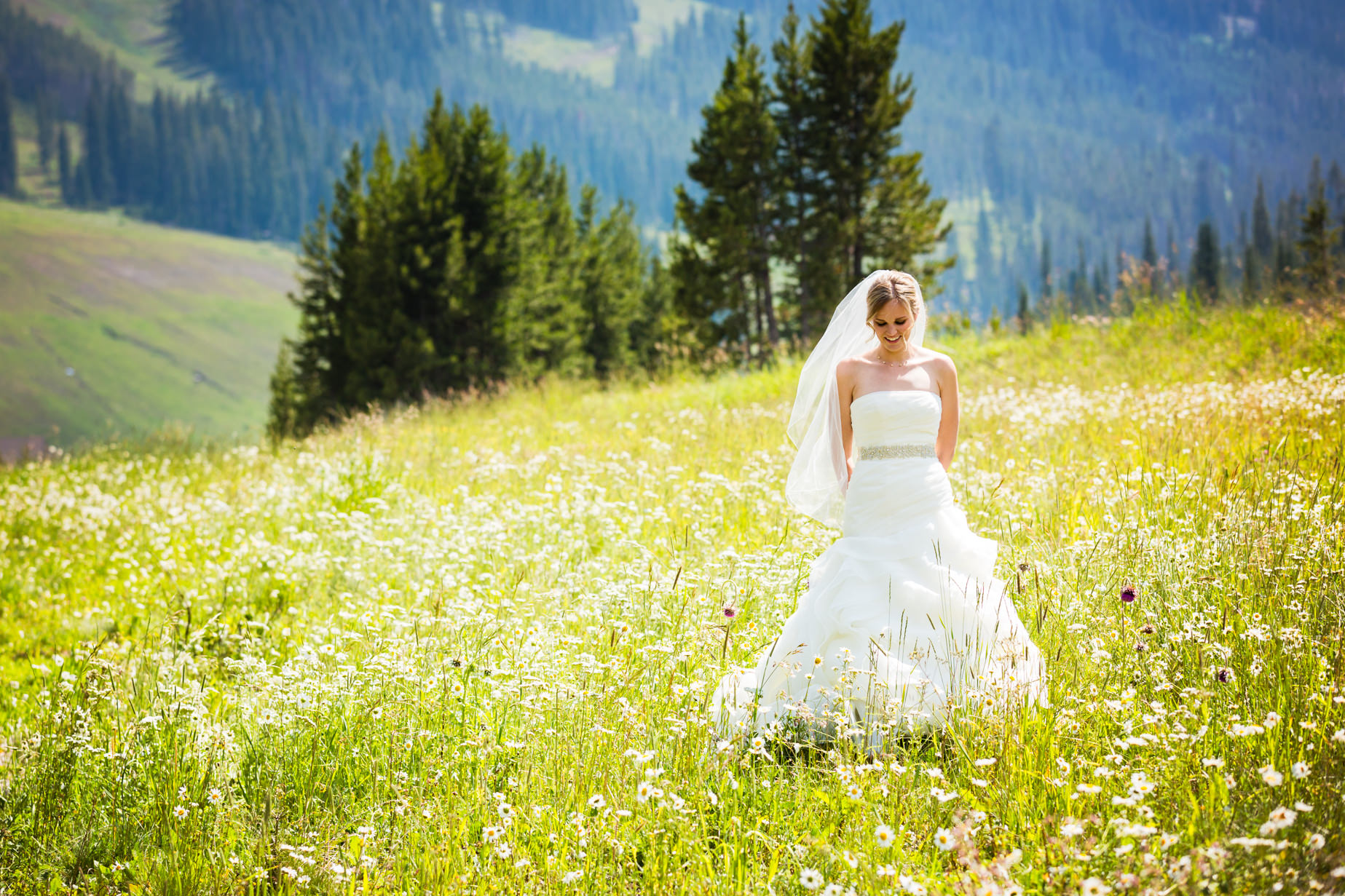 big-sky-resort-wedding-bride-waits-for-groom-in-field.jpg