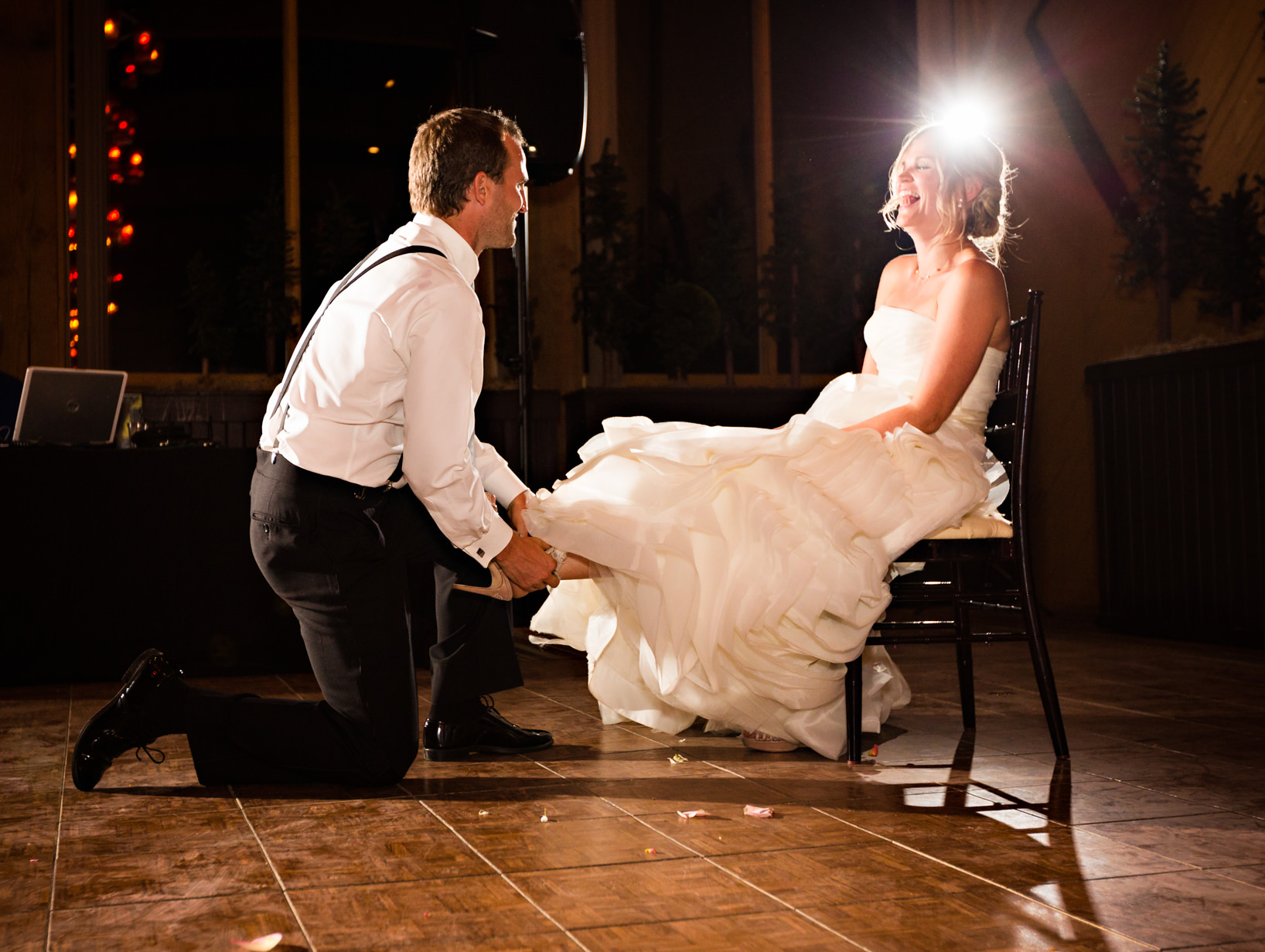 big-sky-resort-wedding-groom-removes-garter.jpg