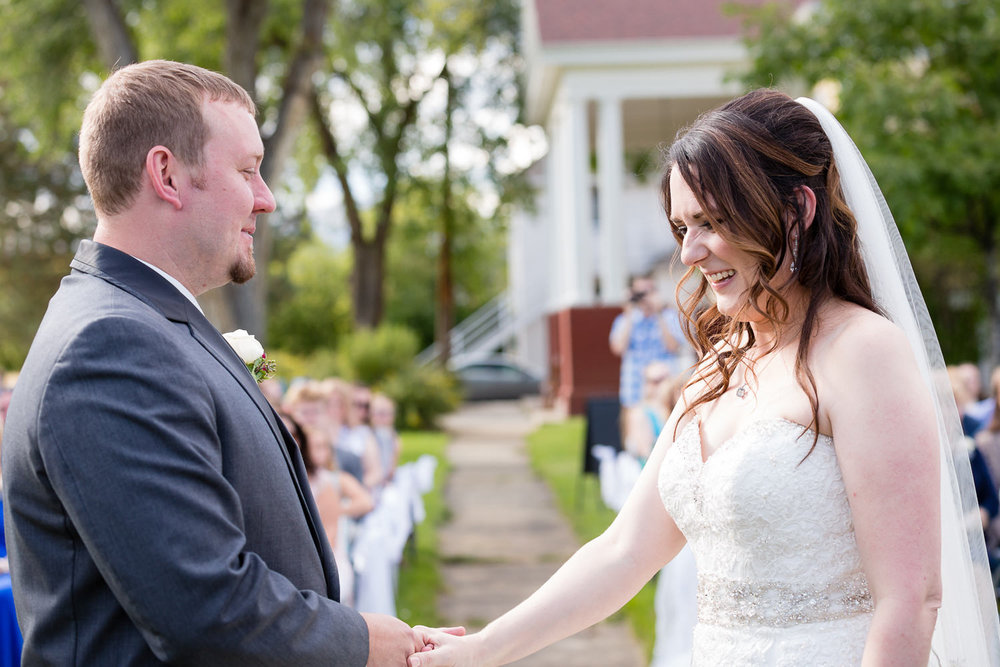 heritage-hall-missoula-montana-bride-groom-laugh-during-ceremony.jpg