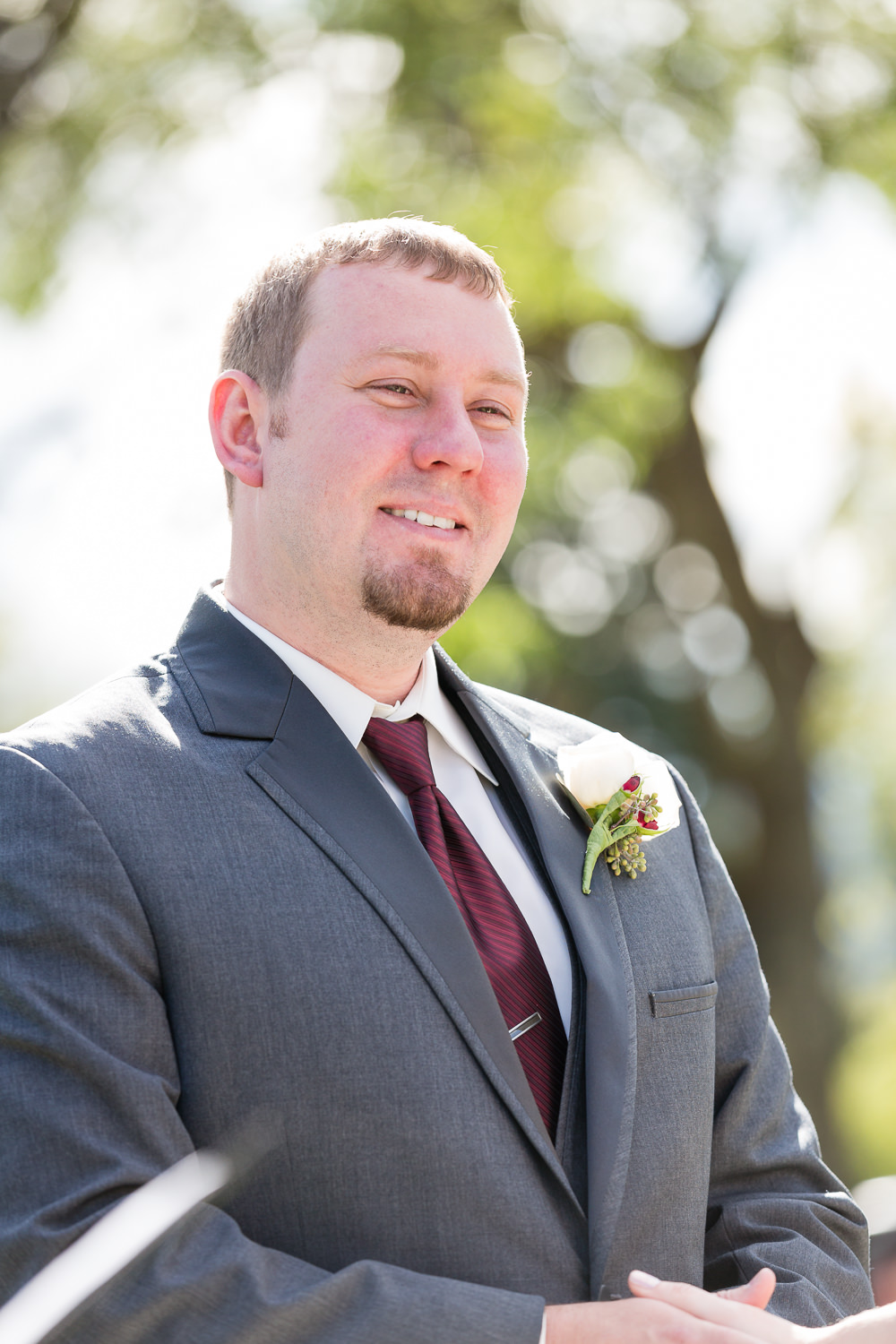 heritage-hall-missoula-montana-groom-laughs-during-ceremony.jpg