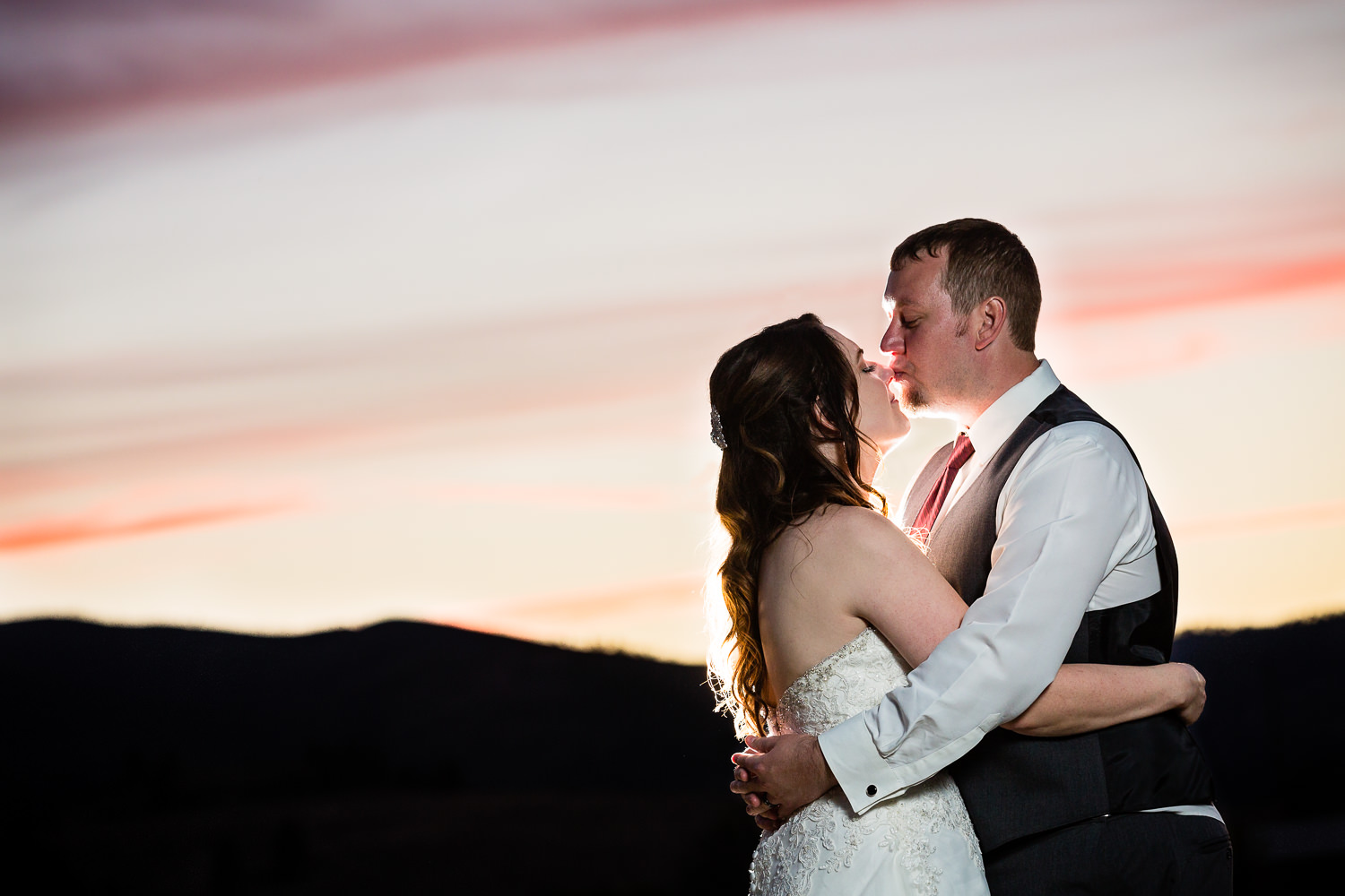 heritage-hall-missoula-montana-bride-groom-sunset-kiss.jpg