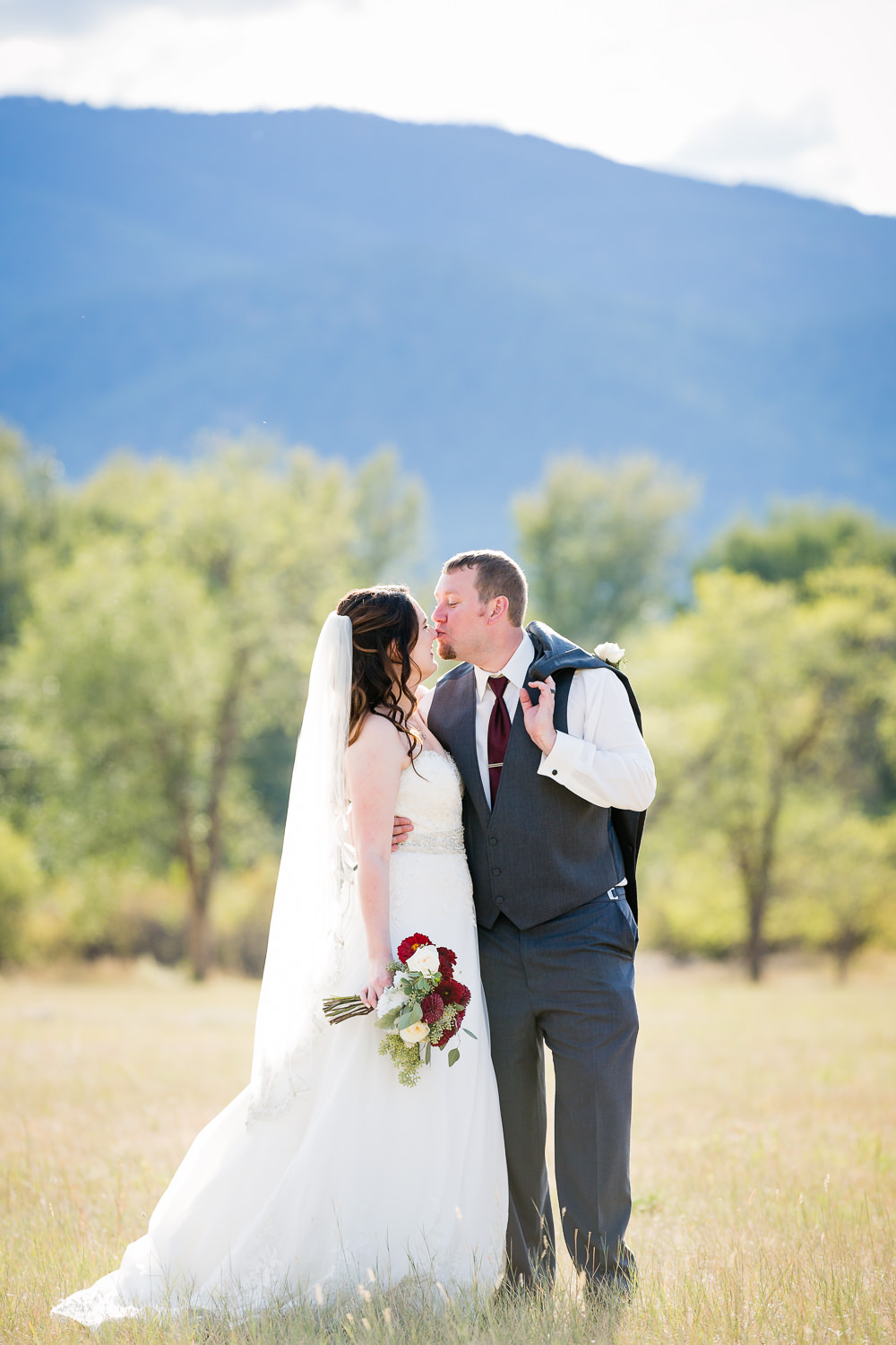 heritage-hall-missoula-montana-groom-kisses-brides-nose.jpg