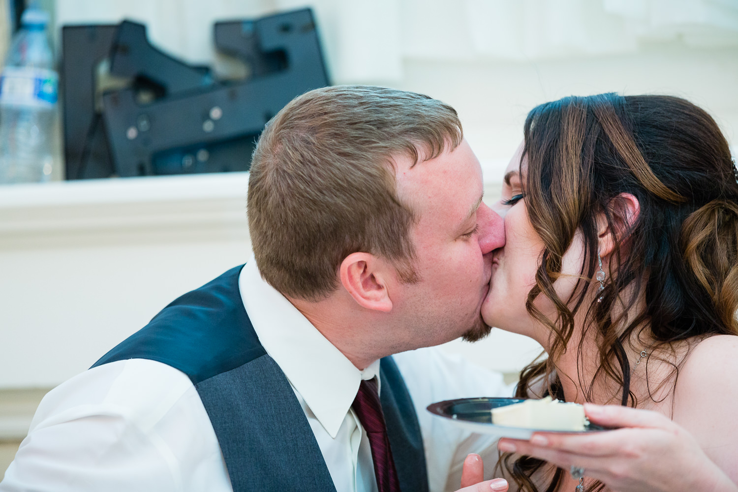 heritage-hall-missoula-montana-bride-groom-kiss-after-toasts.jpg