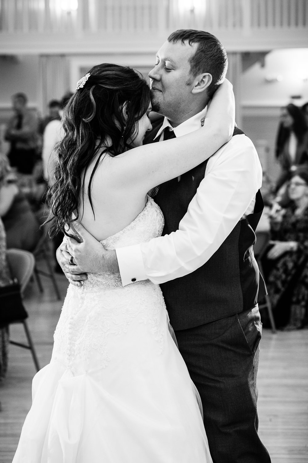 heritage-hall-missoula-montana-groom-kisses-brides-forehead-during-first-dance.jpg