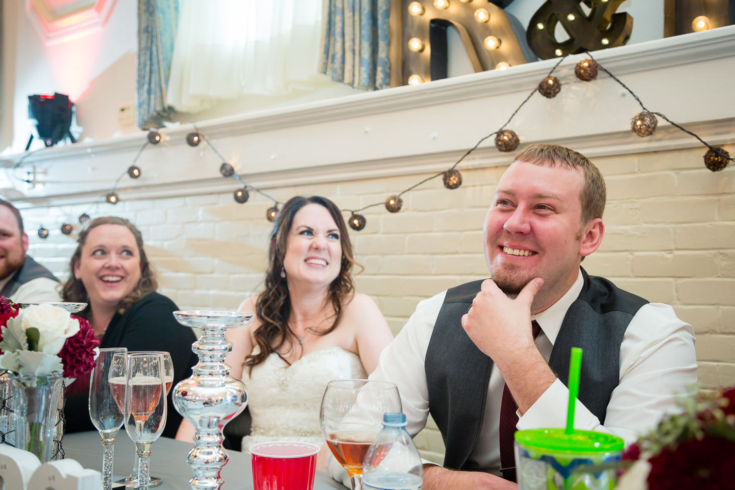 heritage-hall-missoula-montana-groom-laughing-during-toast.jpg