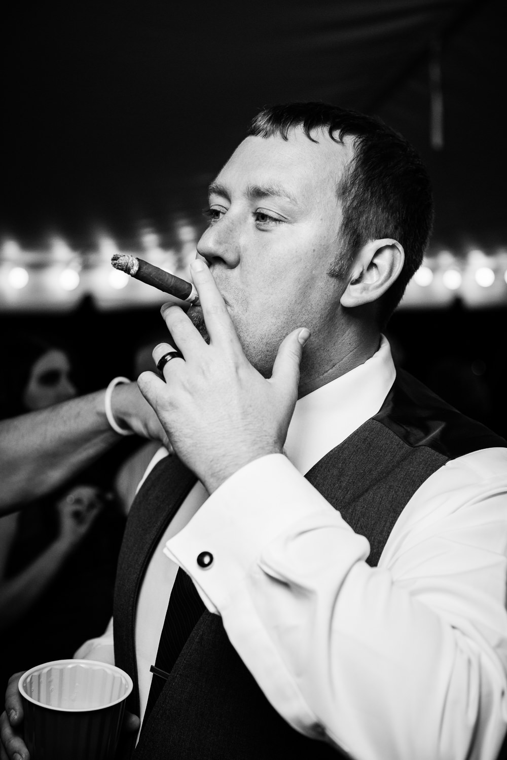 heritage-hall-missoula-montana-groom-smokes-cigar.jpg