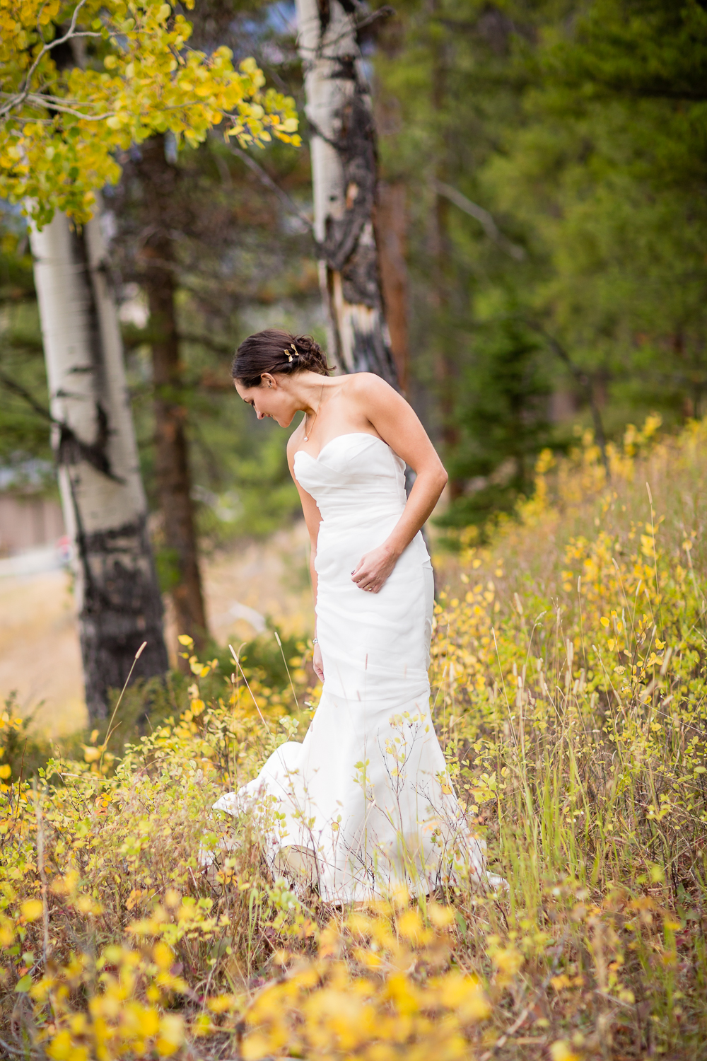 big-sky-montana-gallatin-riverhouse-wedding-bride-picks-up-back-of-dress.jpg