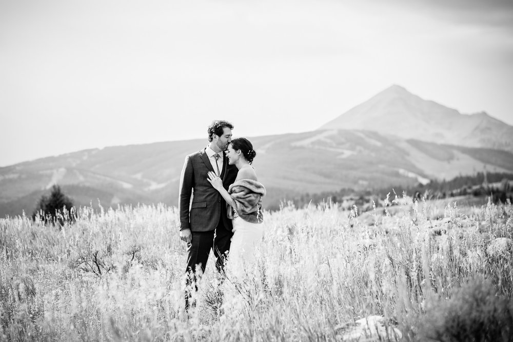 big-sky-montana-gallatin-riverhouse-wedding-groom-kisses-brides-forehead.jpg