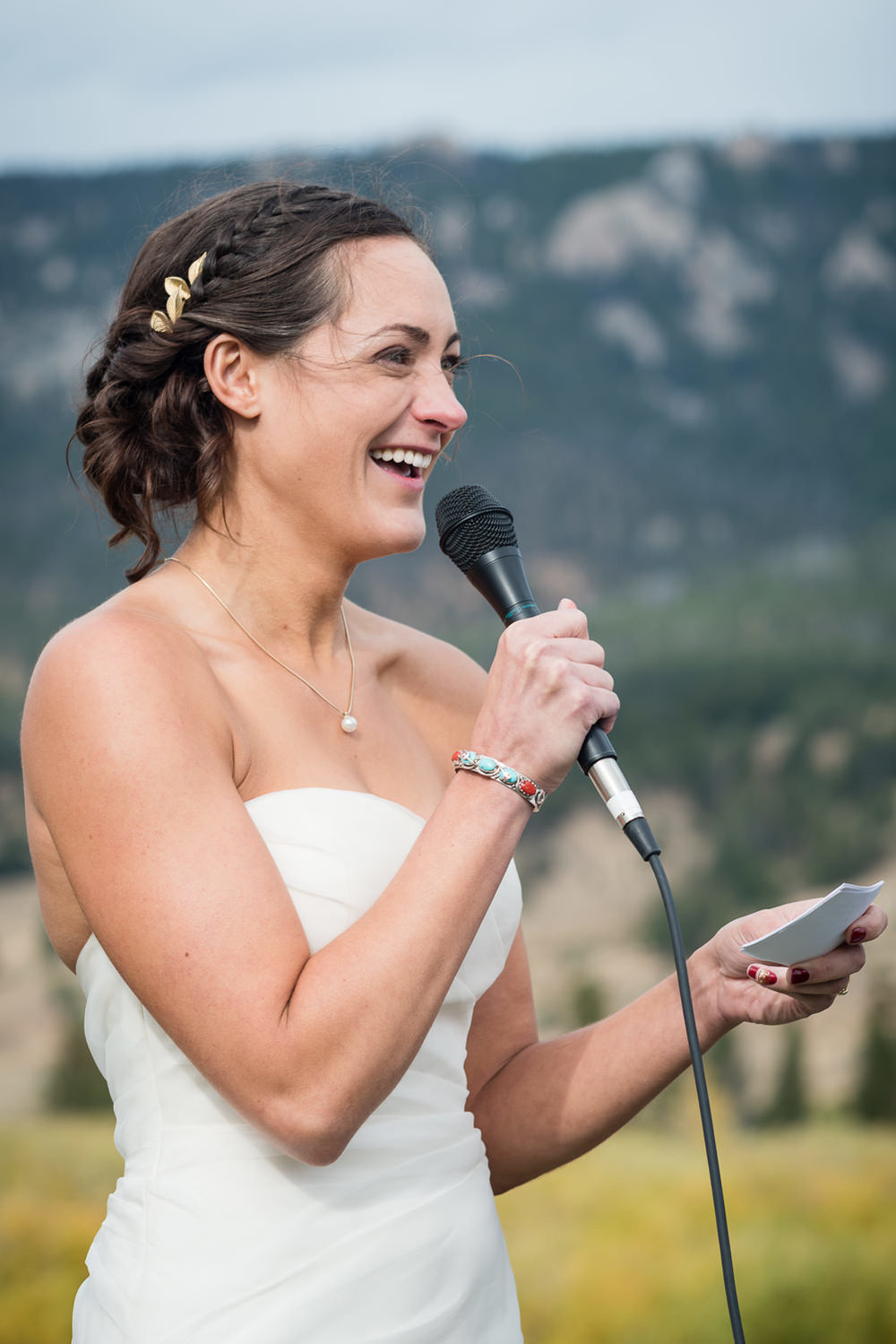 big-sky-montana-gallatin-riverhouse-wedding-bride-laughs-during-vows.jpg