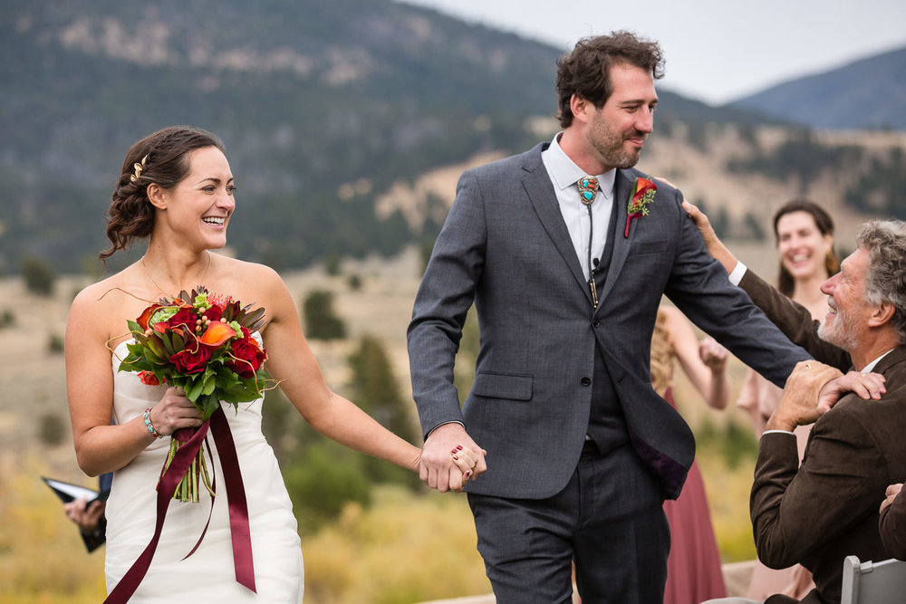 big-sky-montana-gallatin-riverhouse-wedding-dad-congratulates-groom.jpg