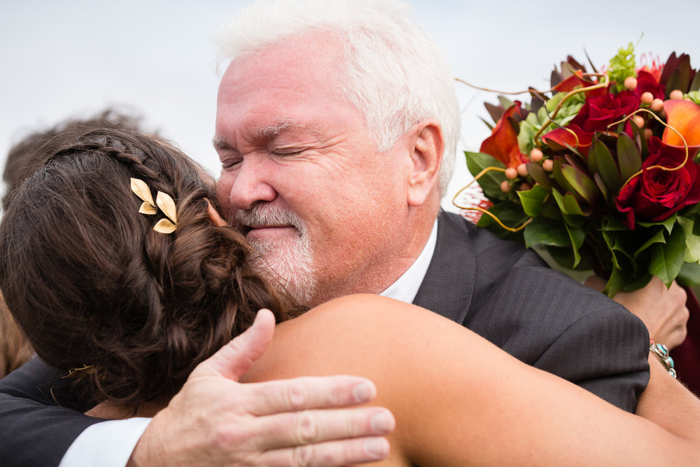 big-sky-montana-gallatin-riverhouse-wedding-dad-hugs-bride.jpg