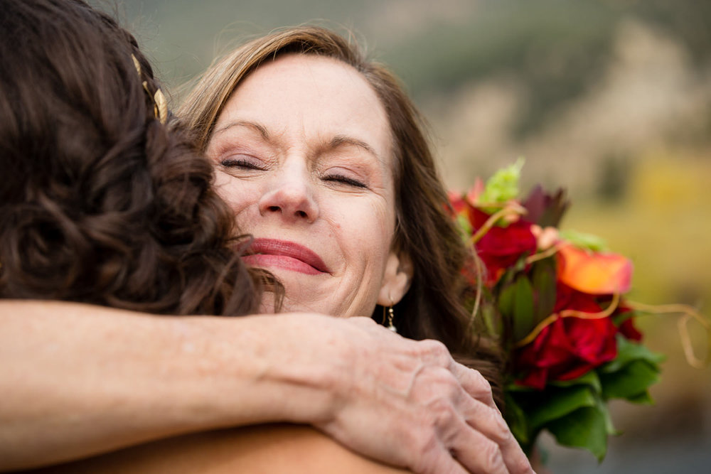 big-sky-montana-gallatin-riverhouse-wedding-mom-hugs-bride.jpg