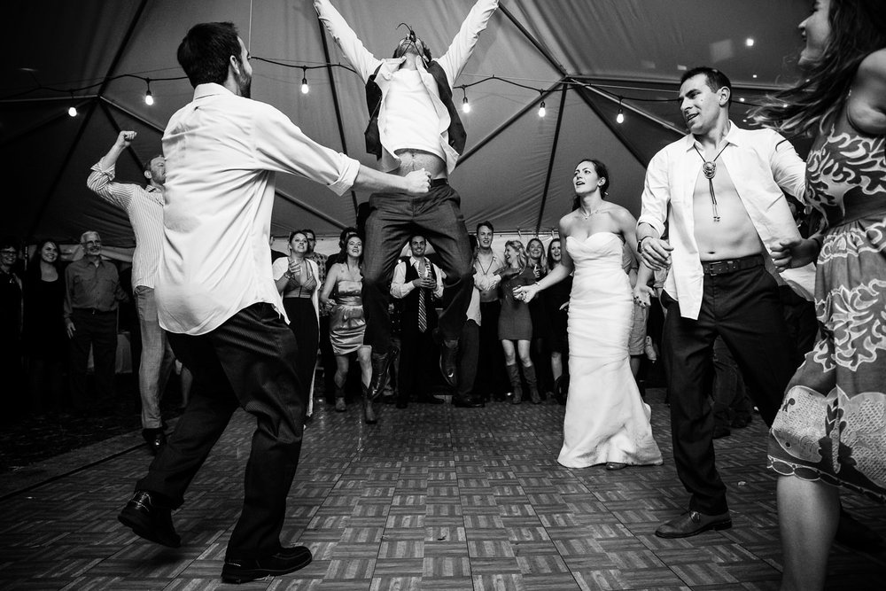 big-sky-montana-gallatin-riverhouse-wedding-groom-leaps-off-dance-floor.jpg