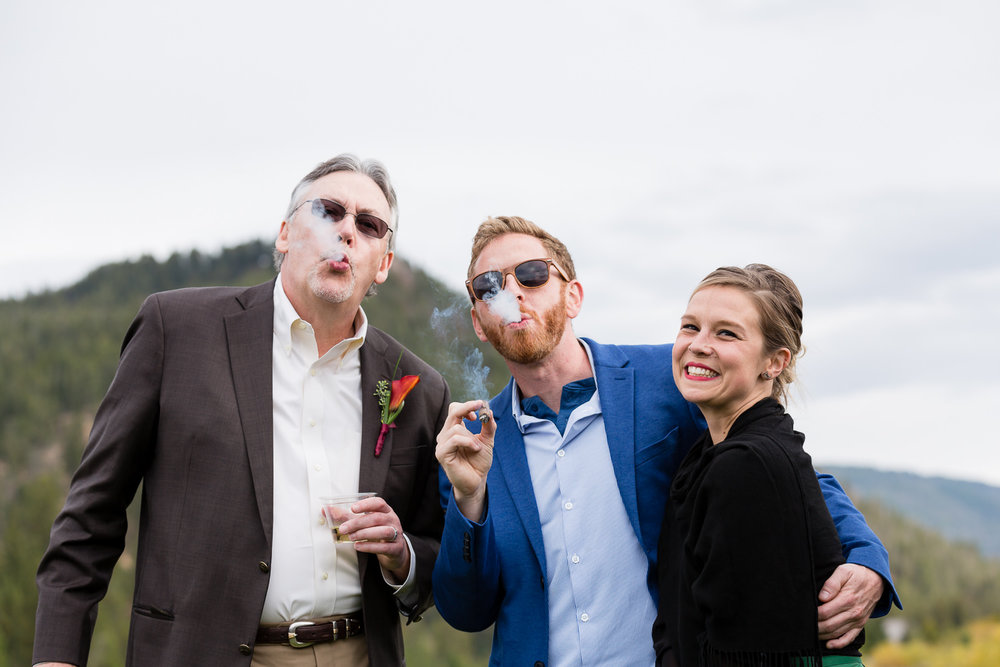 big-sky-montana-gallatin-riverhouse-wedding-guests-smoking-cigars.jpg