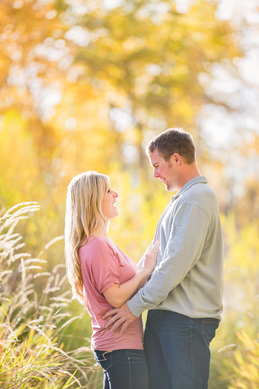 bozeman-montana-engagement-session-couple-laughing-fall-colors-background.jpg