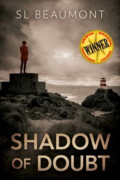 Cover image of Shadow of Doubt by SL Beaumont, showing a woman in a red coat looking towards a lighthouse on the rugged Scottish coast