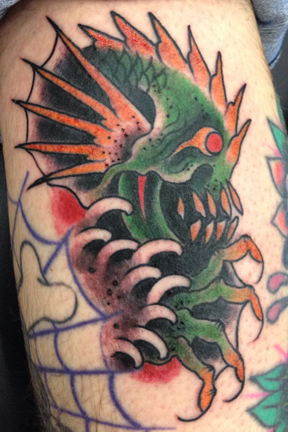 Colorful Sea Creature Monster Tattoo On Chest And Shoulders