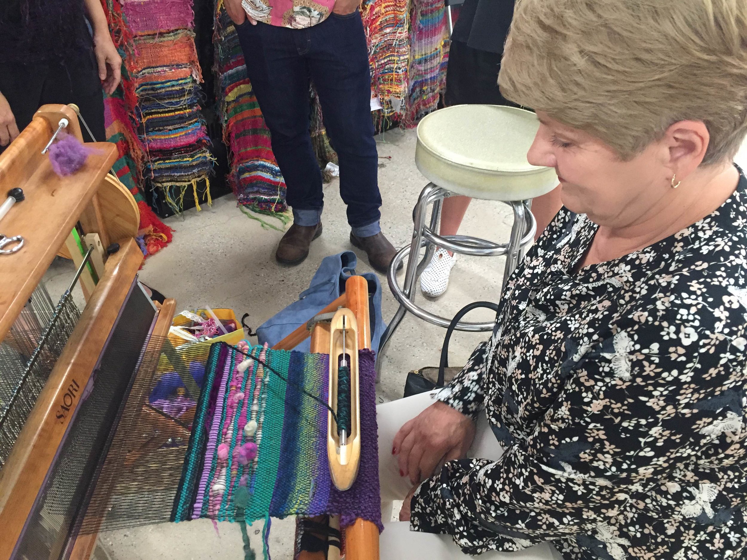Visitor from Poland weaving on a SAORI loom for the first time! Thank you for coming!