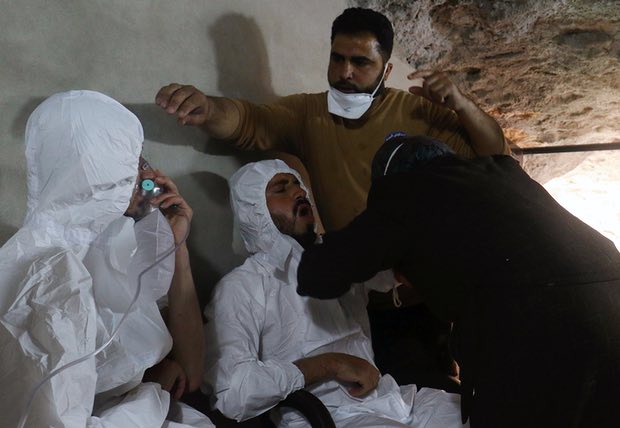 Two men in Syria receive treatment after the suspected chemical weapon attack. Photograph: Ammar Abdullah/Reuters