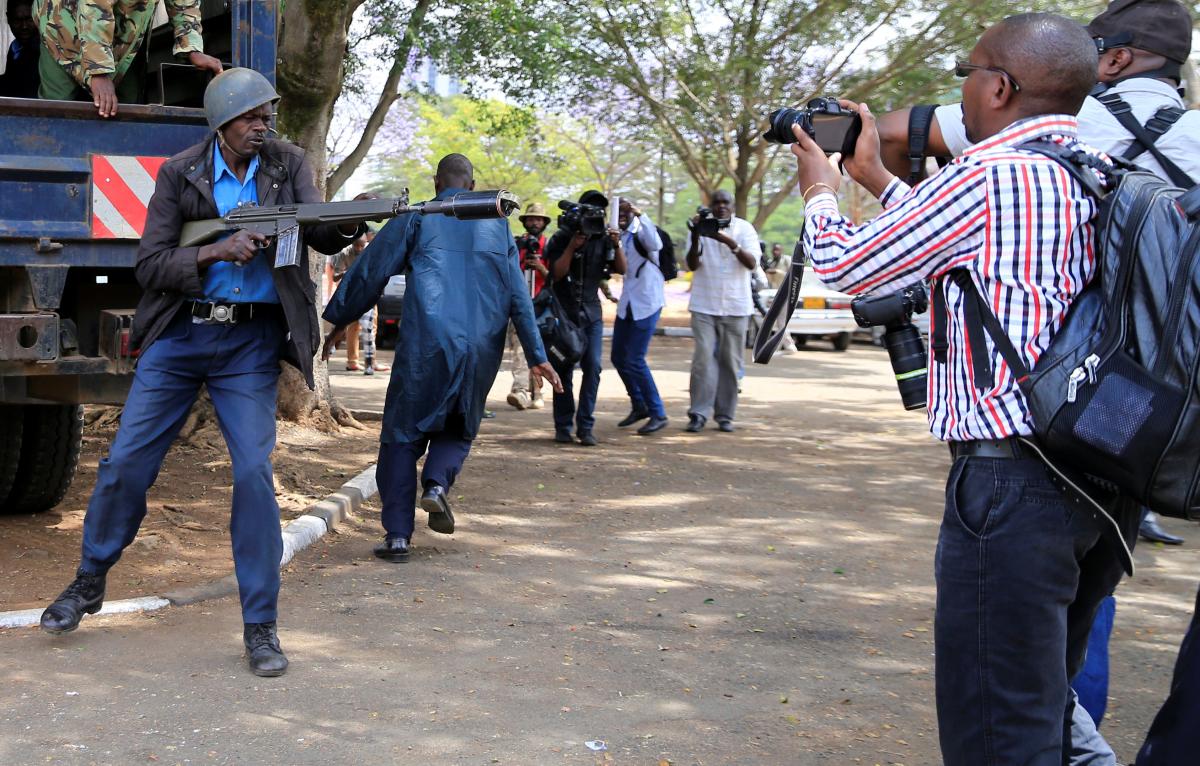 A police officer aims tear gas at in the direction of reporters covering an anti-corruption protest in Kenya. Reuters/Thomas Mukoya