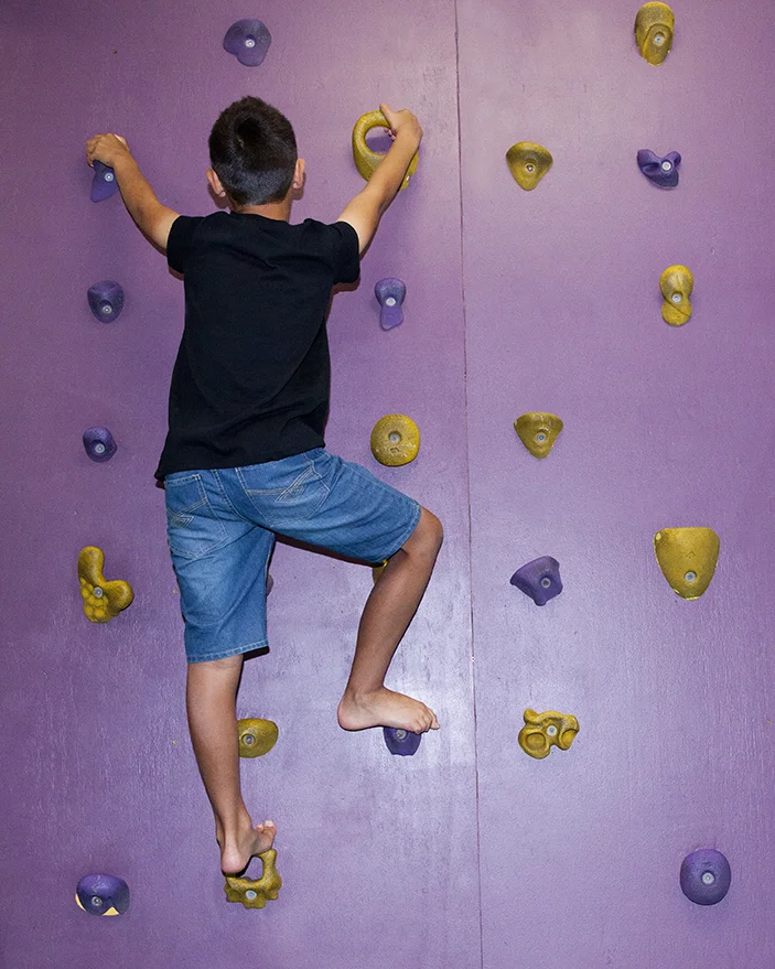 Overcoming fears taking the challenge of the climbing wall