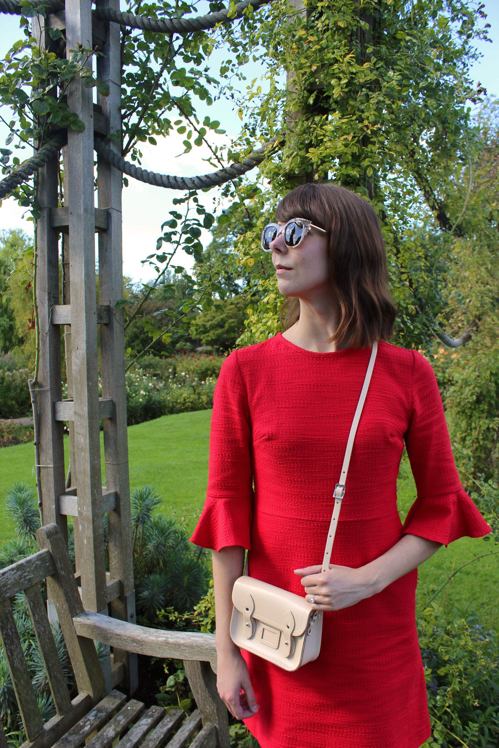 An afternoon in the rose garden at Regent's Park wearing a red dress and neutral accessories.