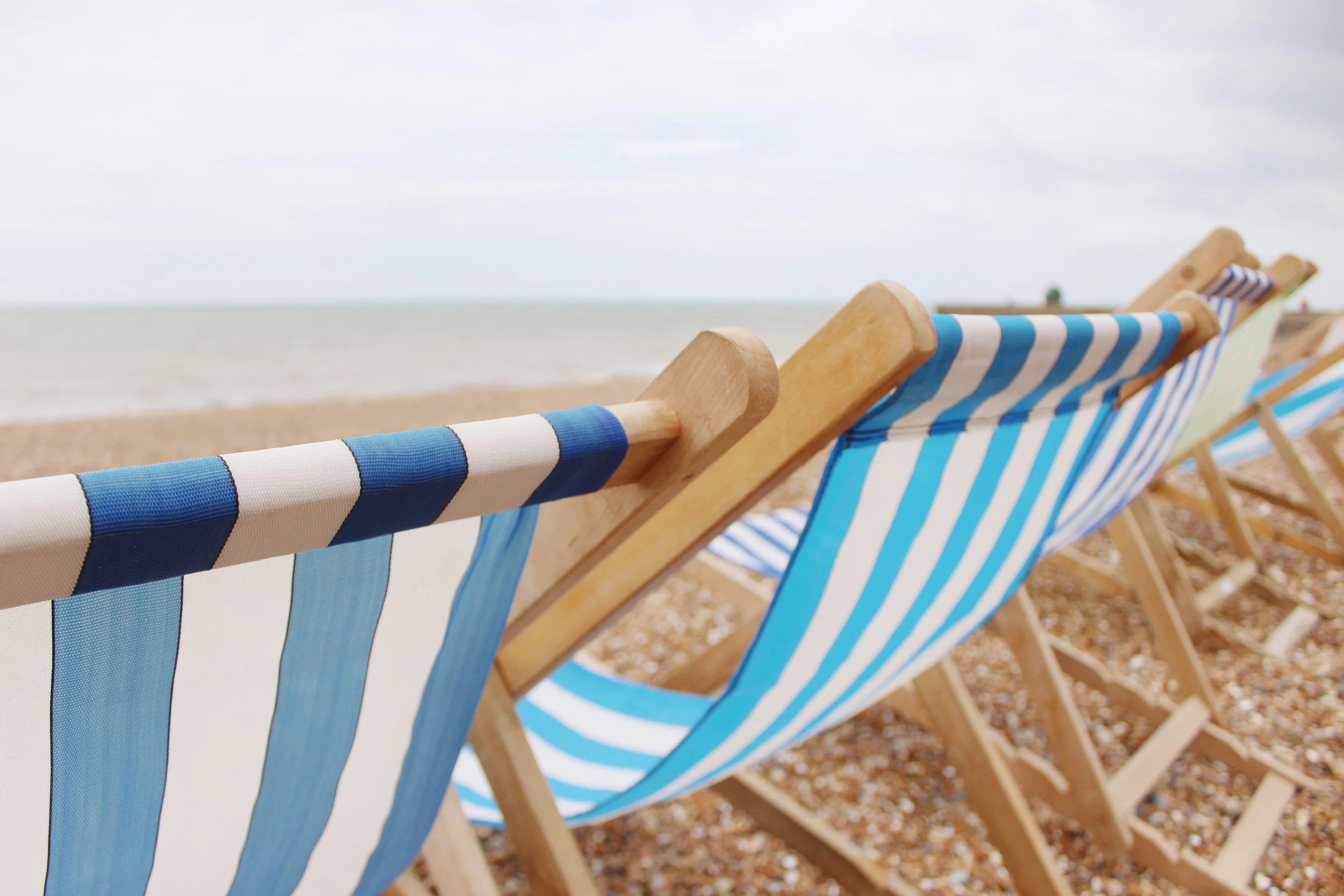 A close-up of the charming striped beach chairs on Brighton Beach.
