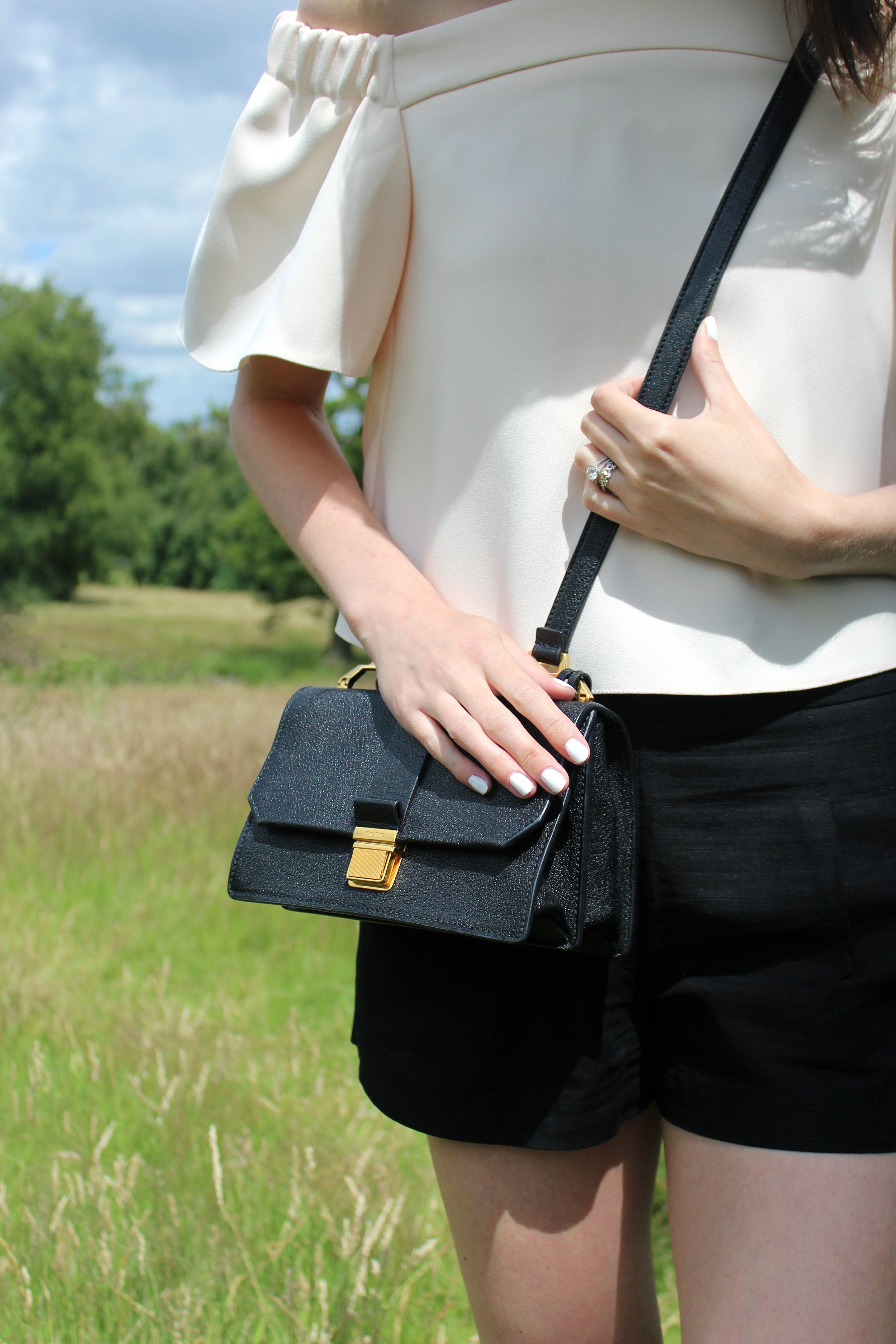 Miu Miu bag and Topshop blush pink off the shoulder top at Hampstead Heath, London
