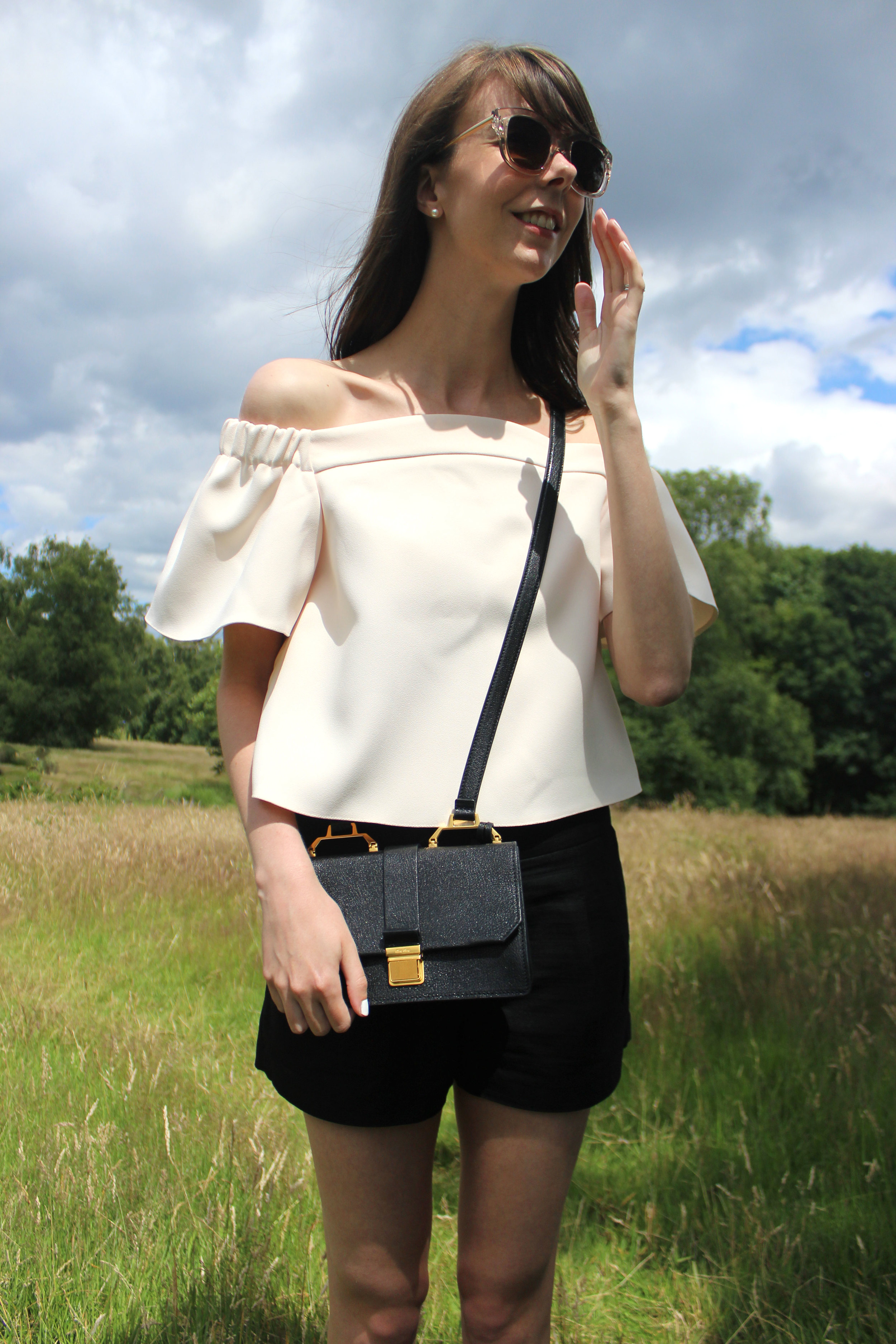 Miu Miu bag and Topshop blush pink off the shoulder top at Hampstead Heath, London