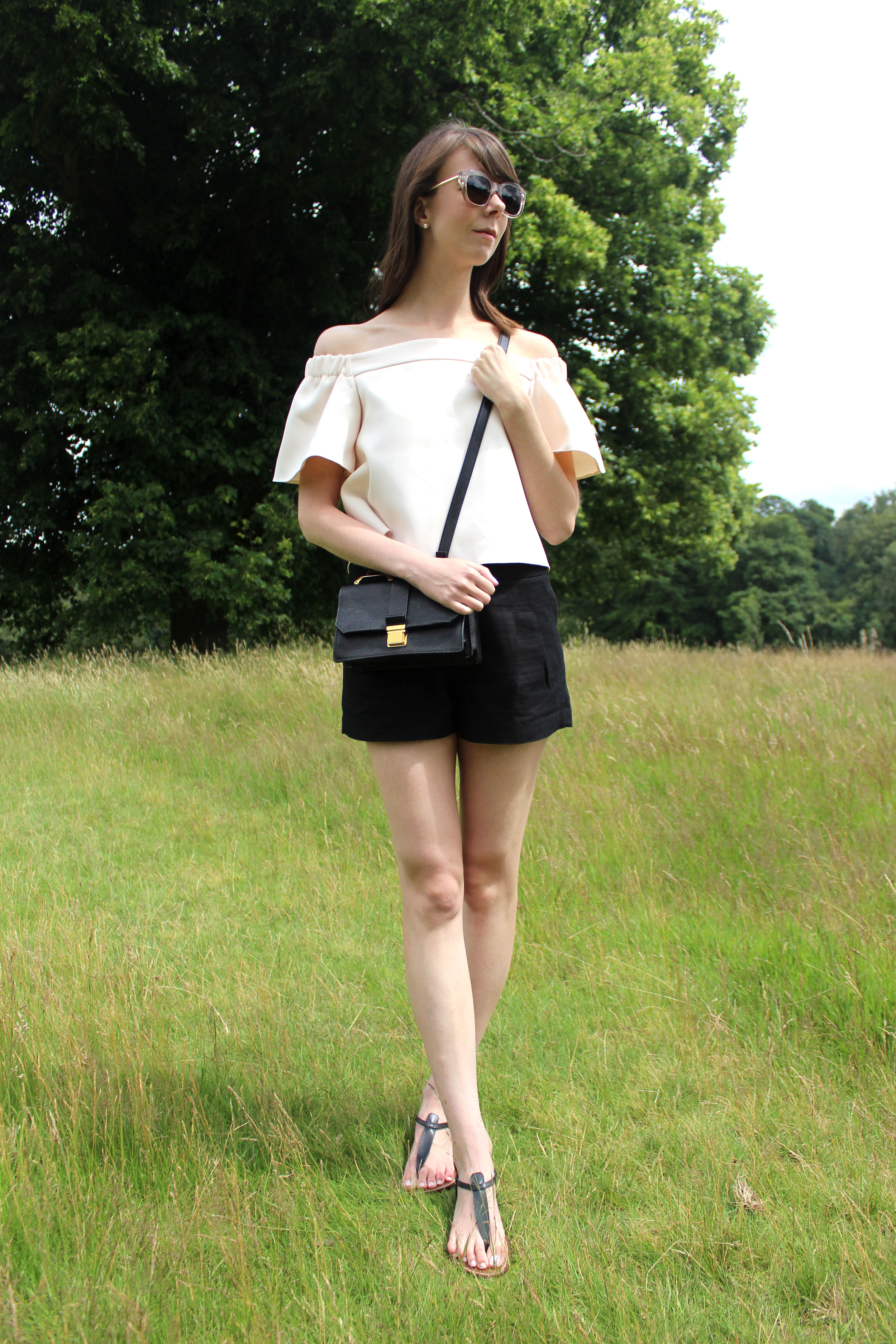 Miu Miu bag and Topshop blush pink off the shoulder top at Hampstead Heath, London.