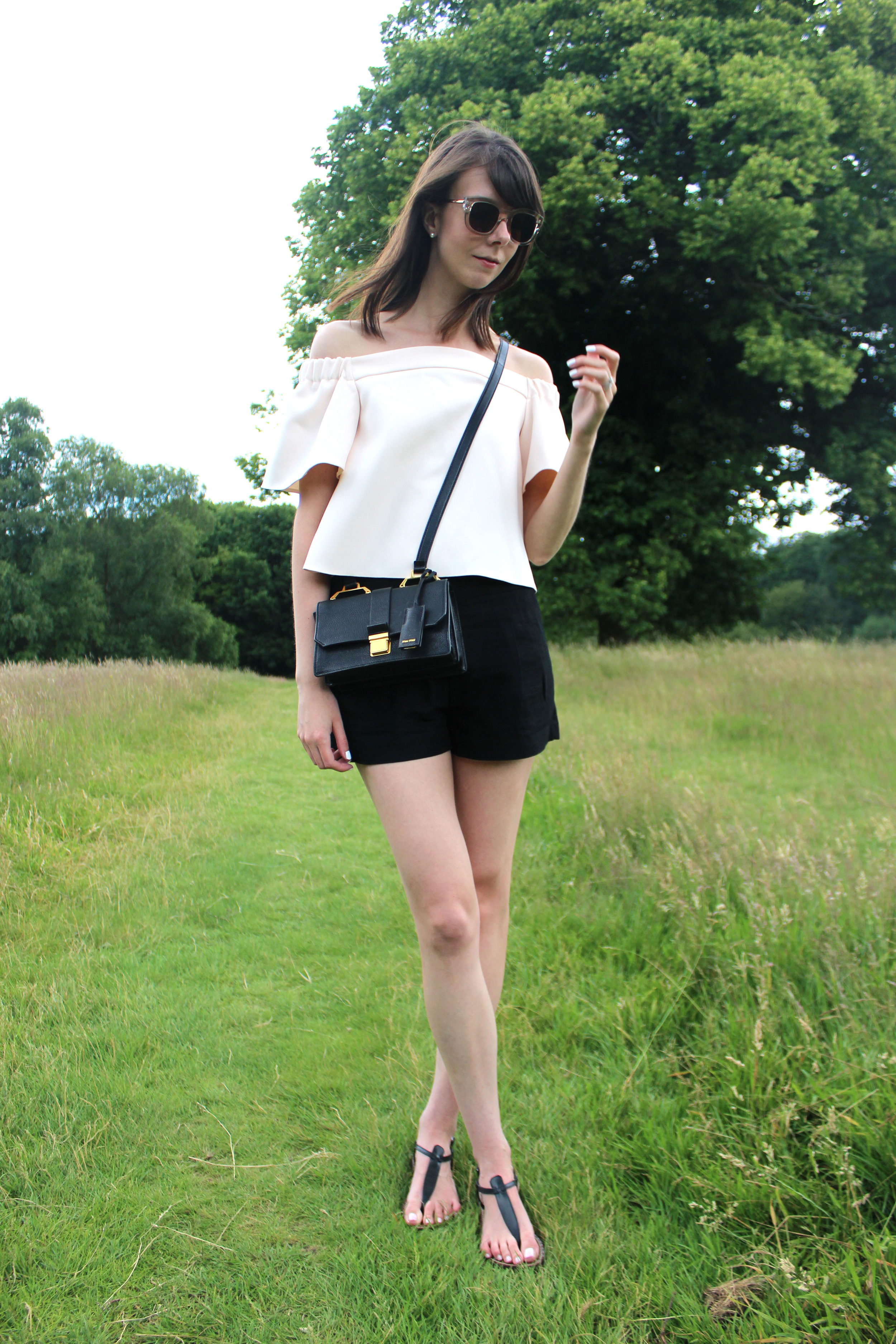 Miu Miu bag and Topshop blush pink off the shoulder top at Hampstead Heath, London