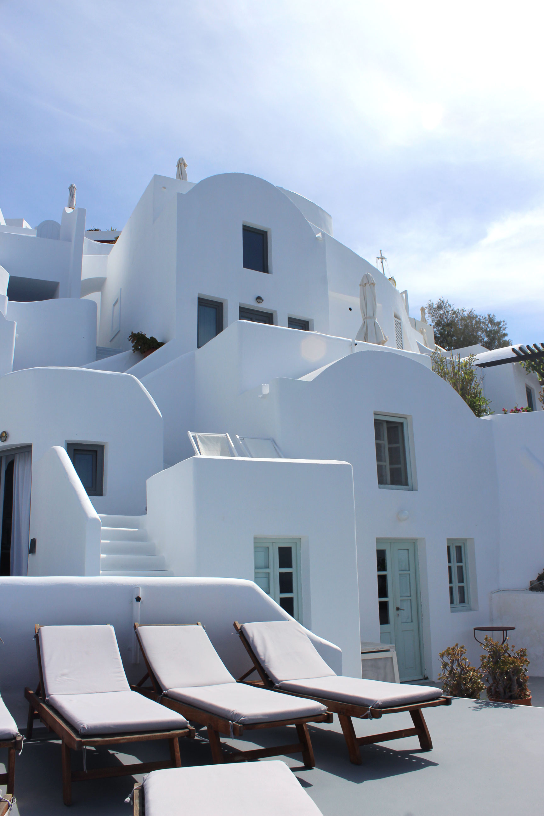 The pool and sunning area at Ikies Hotel on the island of Santorini, Greece.