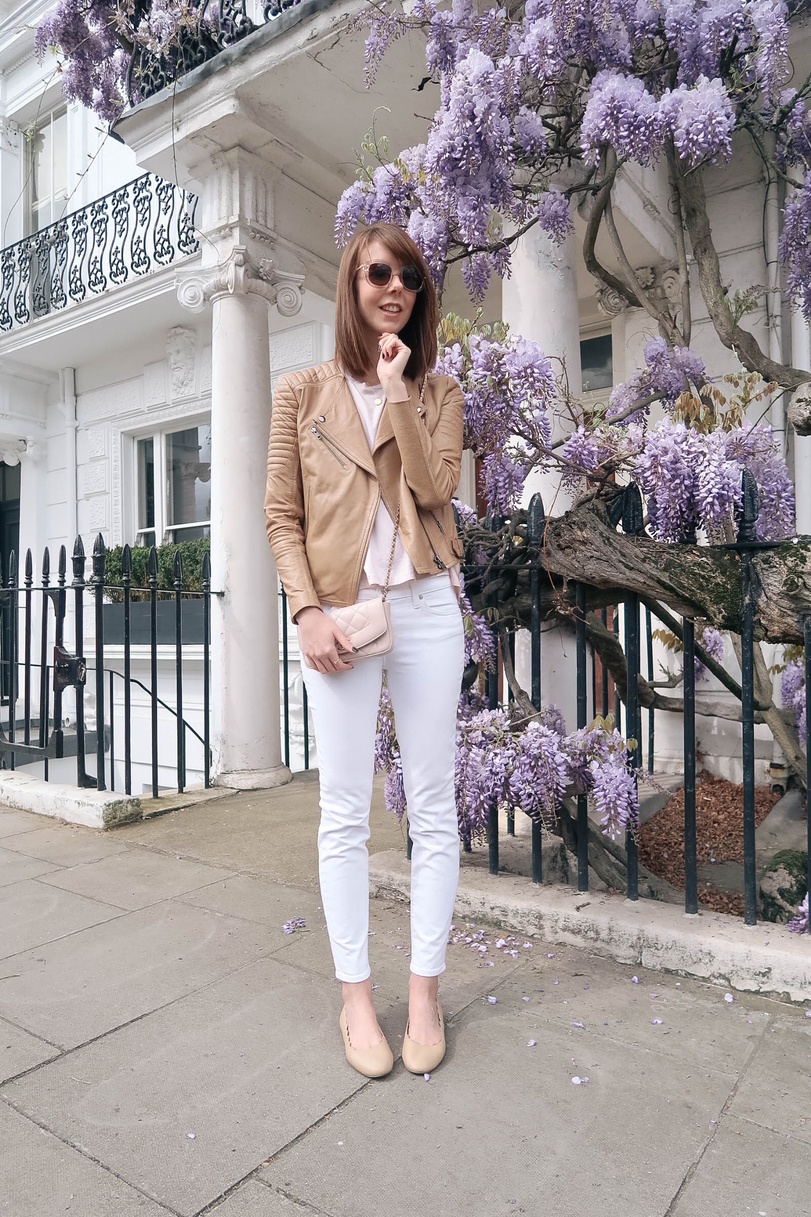 Purple wisteria blossoms in Notting Hill, London wearing J.Crew jeans and a Chanel quilted bag | Pink, Purple and Petals | Sundays and Somedays