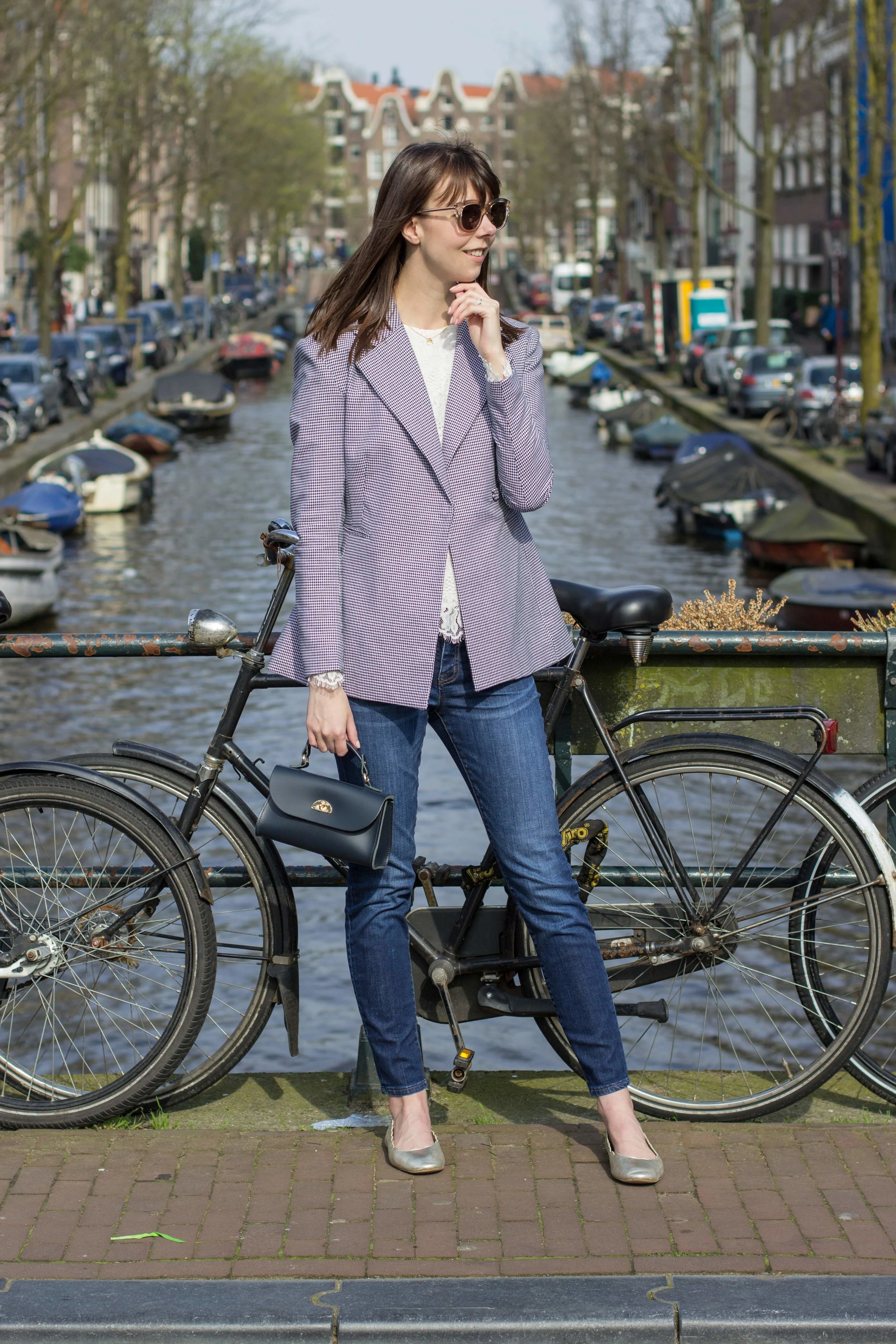 Wearing the checked blue and white blazer for spring over a lace top, delicate accessories and a Cambridge Satchel Company Daisy bag for spring in Amsterdam.