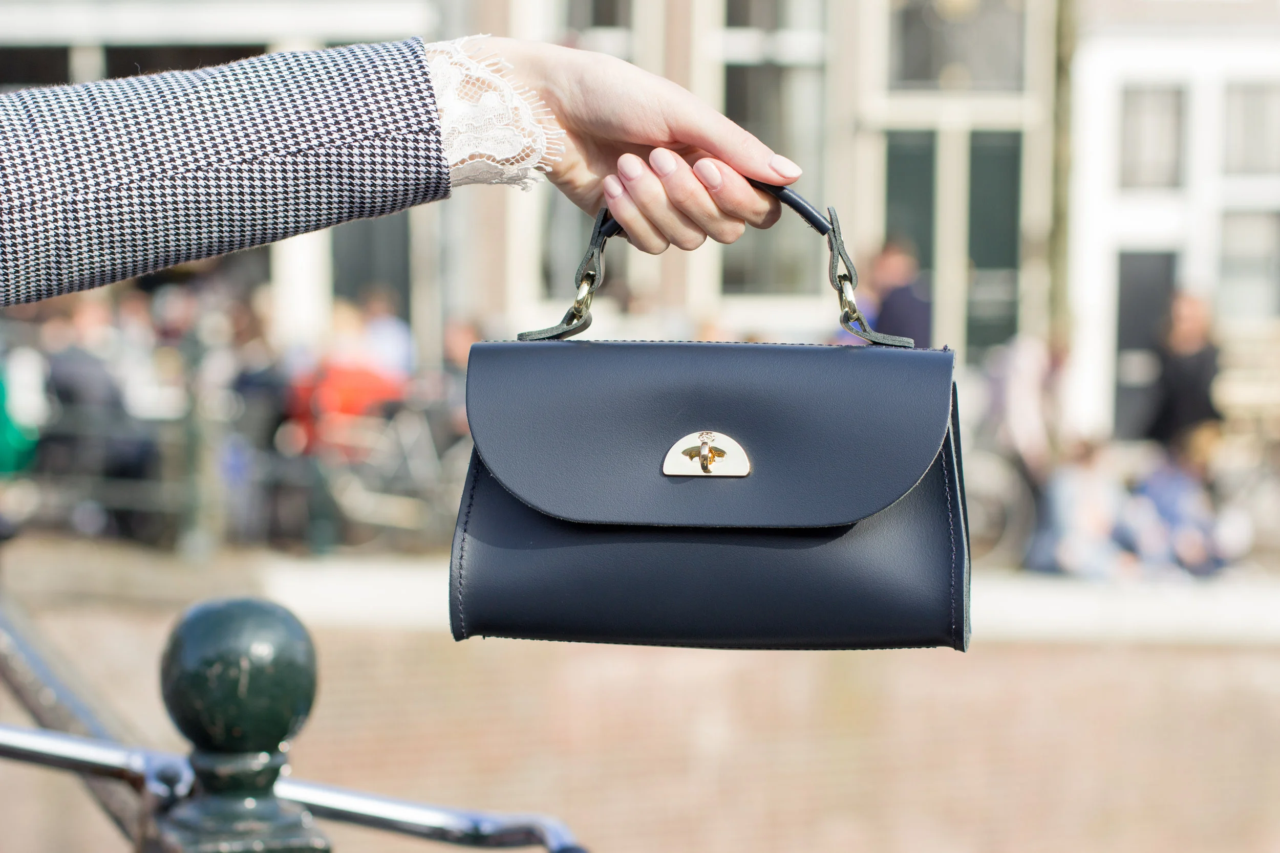 Wearing the checked blue and white blazer for spring over a lace top, delicate accessories and a Cambridge Satchel Company Daisy bag for spring in Amsterdam.