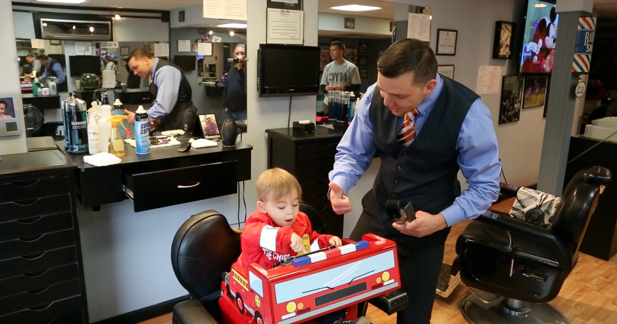 Speak in “Baby Talk”, studies have shown that babies and toddlers respond better to short, simple sentences coupled with higher pitch and exaggerated pronunciation. Use positive reinforcement, telling the child “good job”, “you’re doing great”, ect. helps the child stay positive throughout the haircut.