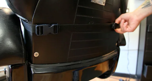 Secure the adjustable safety strap to the chair.