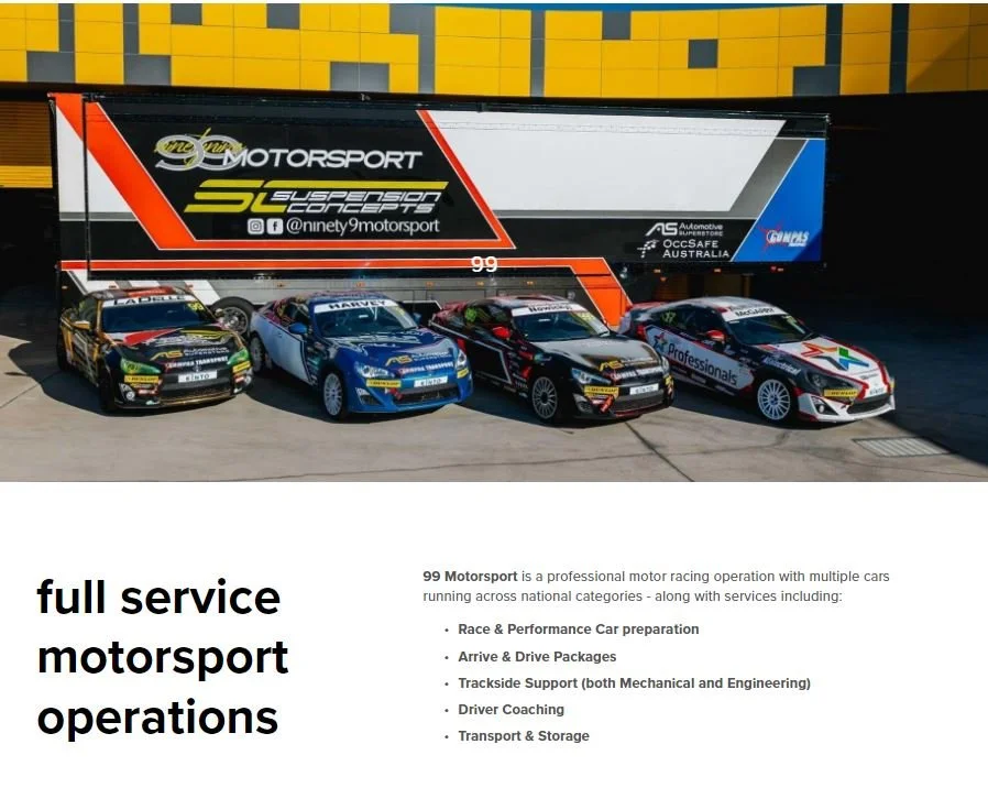 Four race cars parked side by side in front of a large trailer with branding for 99 Motorsport, which specializes in motorsport services and race car preparation.