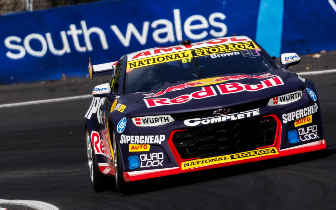 Race car with Red Bull and sponsor logos on a track at South Wales