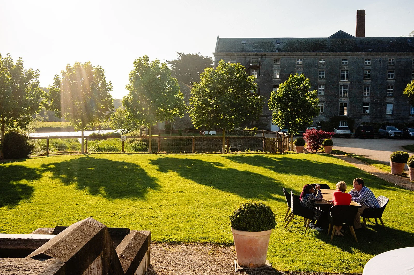 the millhouse in meath with a low lying sun over teh river