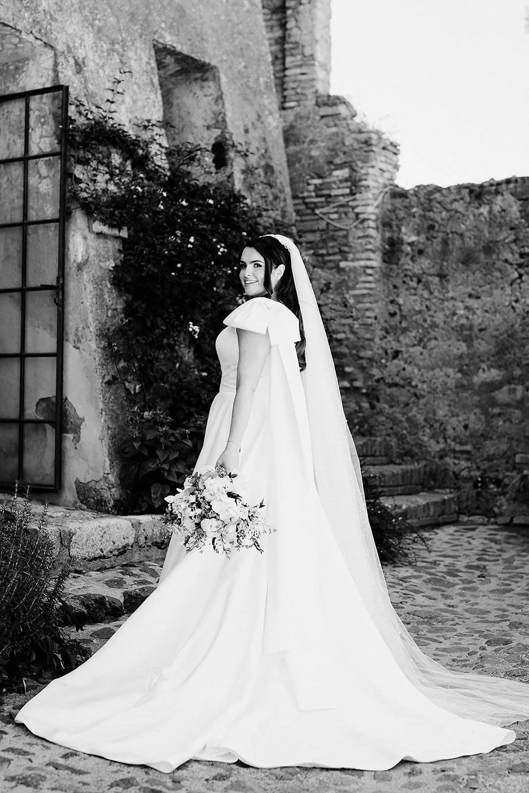 7. Borgo di Tragliata wedding photographer, Niamh and her dad walking into the chapel-10.jpg