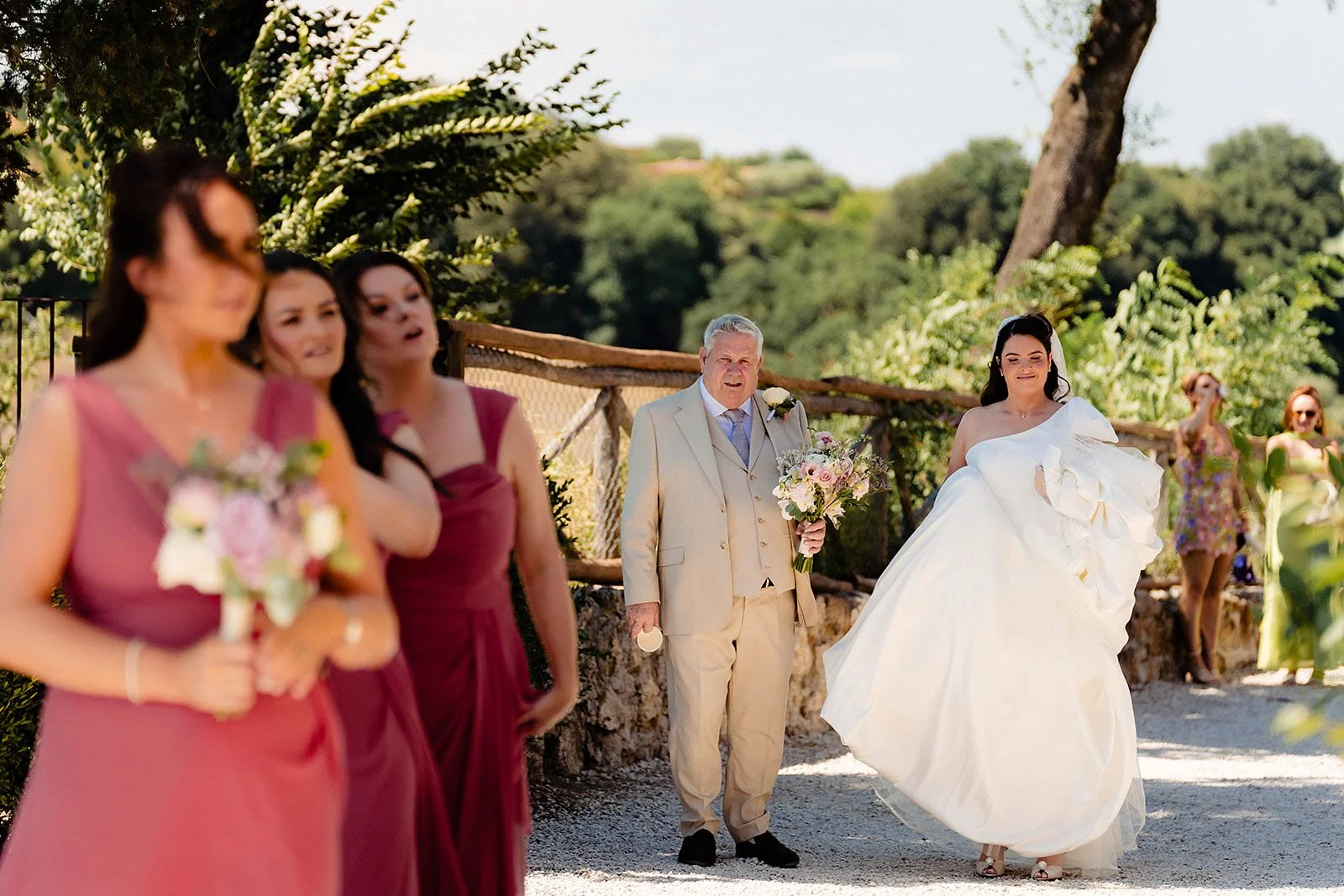 7. Borgo di Tragliata wedding photographer, Niamh and her dad walking into the chapel-14.jpg