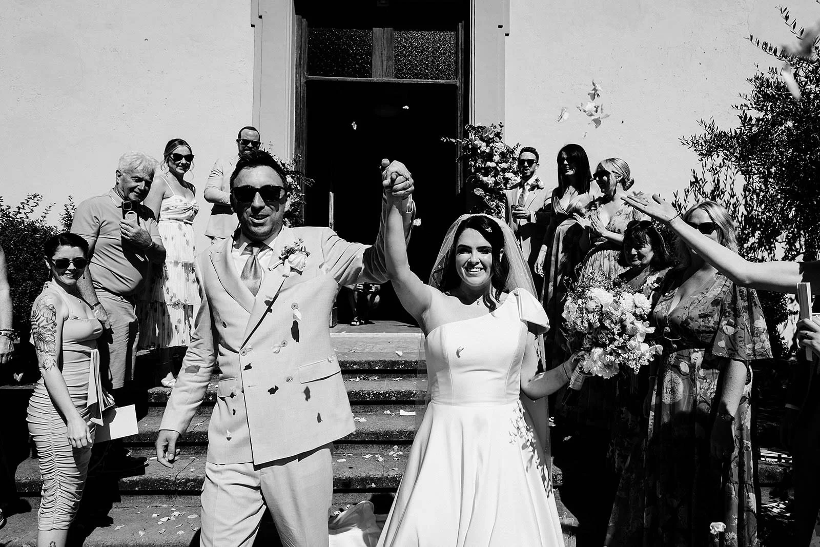 9. Guests with fans in the chapel during a July wedding near Rome-12.jpg