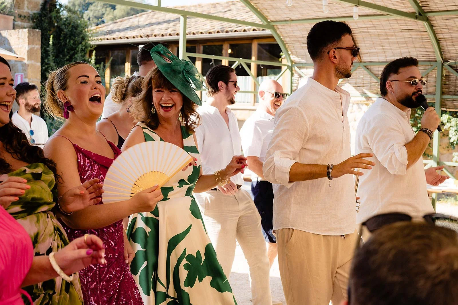 10. Niamh and Dave in the red Fiat with The Gloves brass band behind them at Borgo di Tragliata-5.jpg
