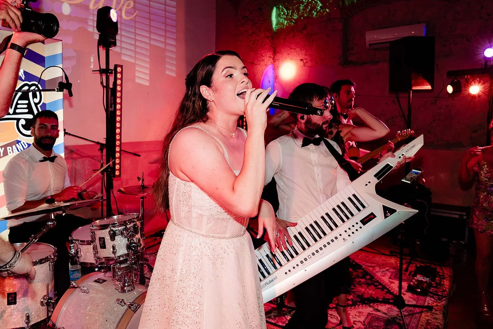 14. Niamh singing Zombie on stage with The Gloves at her Borgo di Tragliata wedding-12.jpg